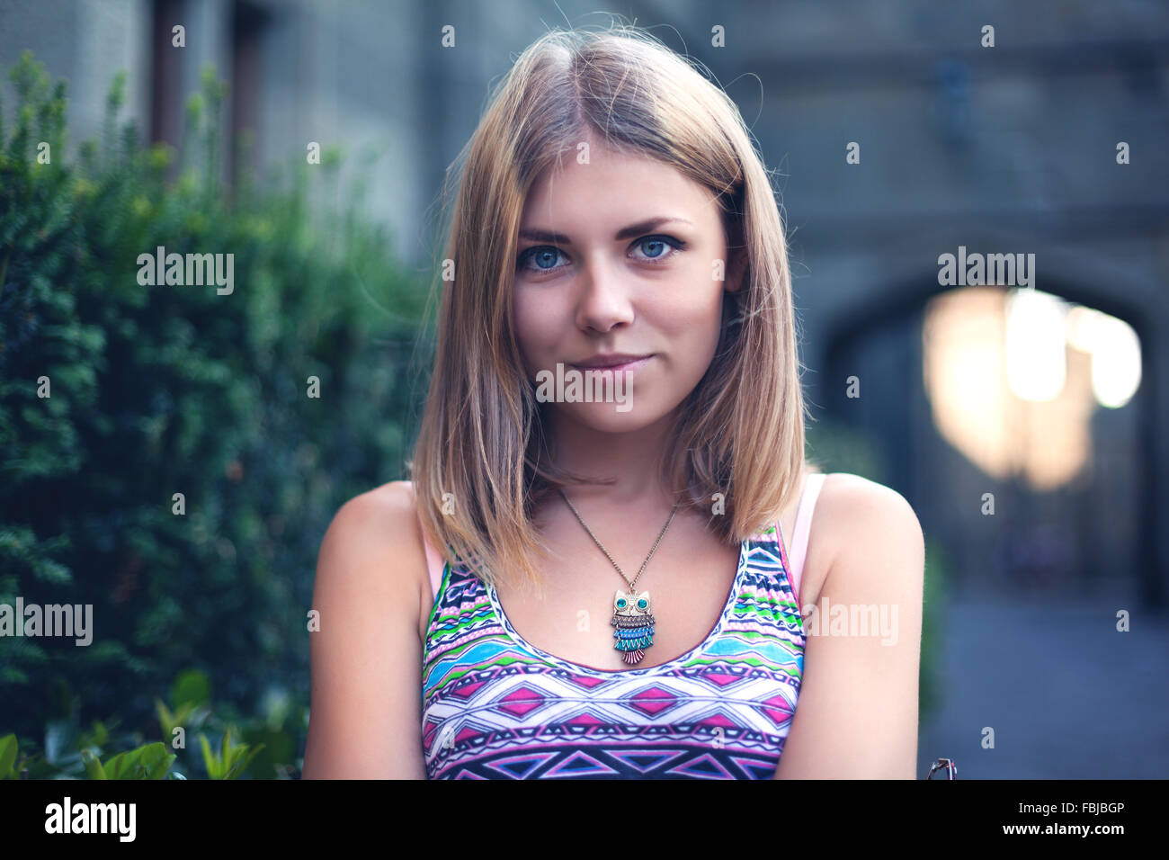 Portrait of a beautiful young woman in park. Stock Photo