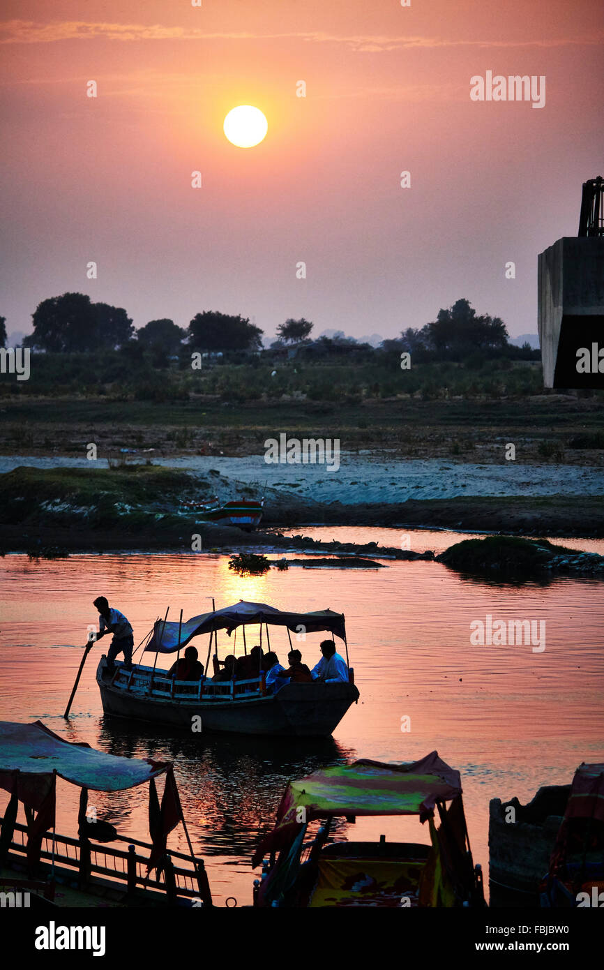 Sunset on the river, boats, temples in the background, Yamuna, India, Vrindavan Stock Photo