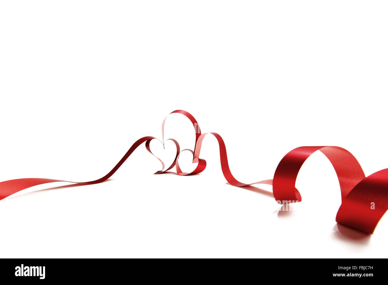Heart shaped red ribbon isolated on white background Stock Photo - Alamy