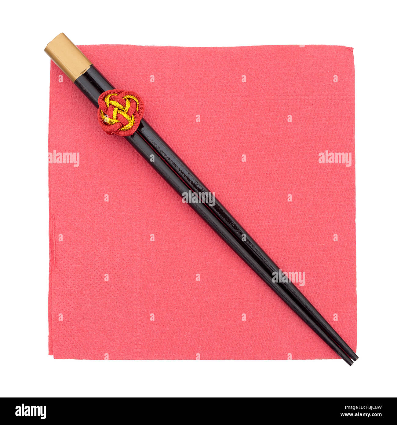 Chopsticks on red serviette, napkin. With lucky knot. Isolated on white. Stock Photo