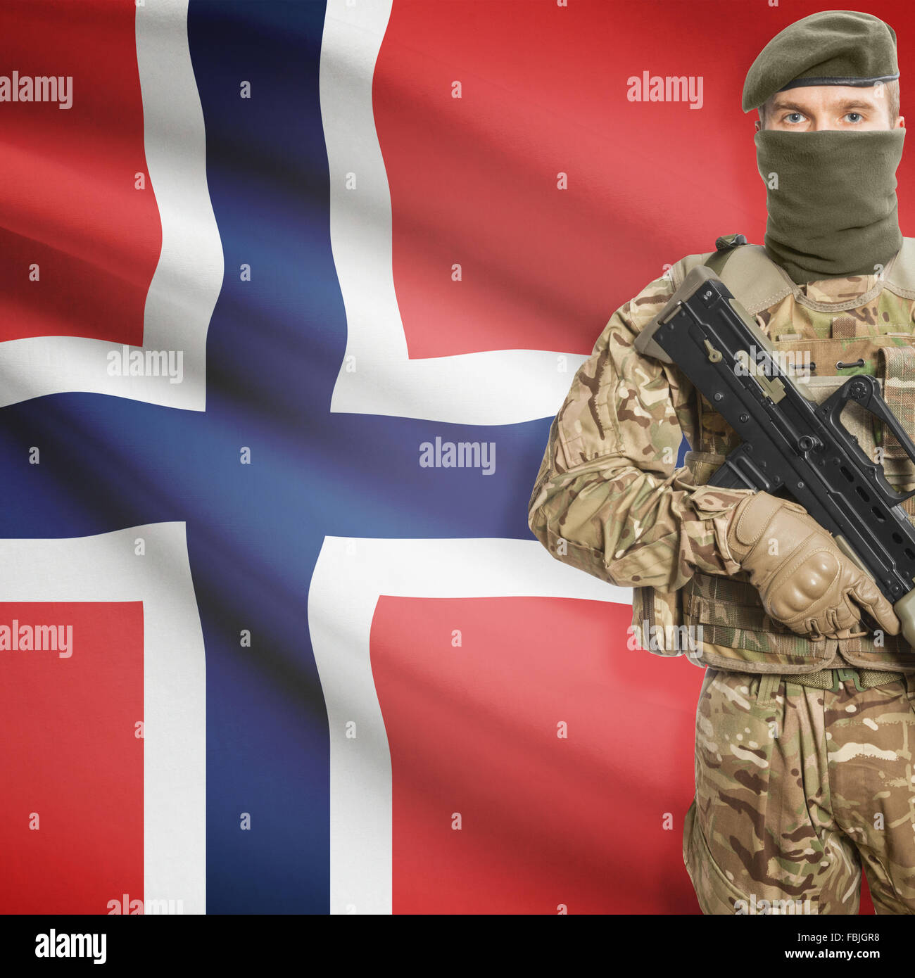 Soldier with machine gun and national flag on background series - Norway Stock Photo