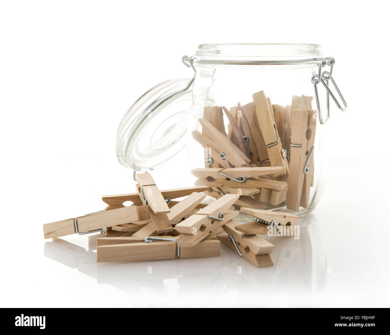 Wooden clothes pegs in a glass Jar Stock Photo Alamy