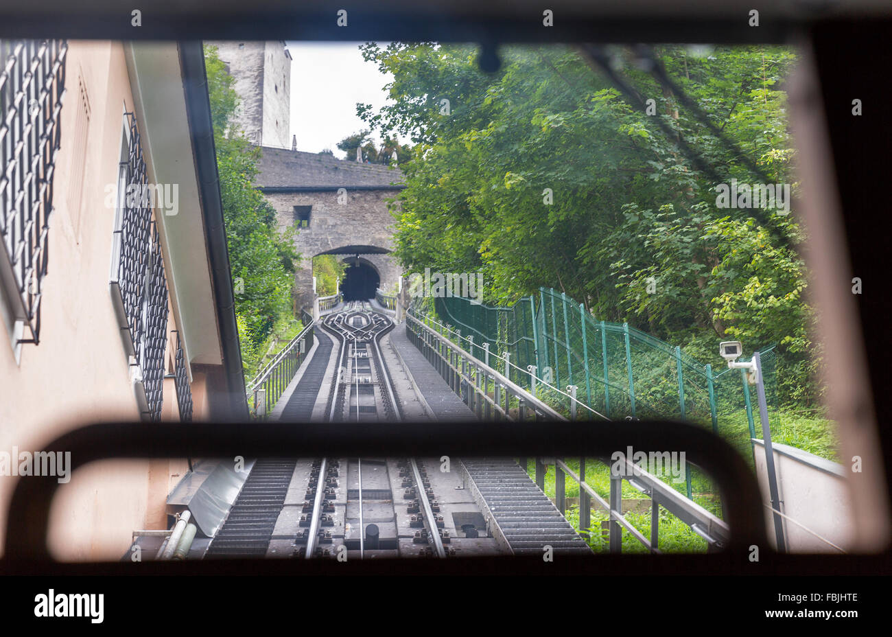 View on cable railroad from cabin of moving up funicular Stock Photo