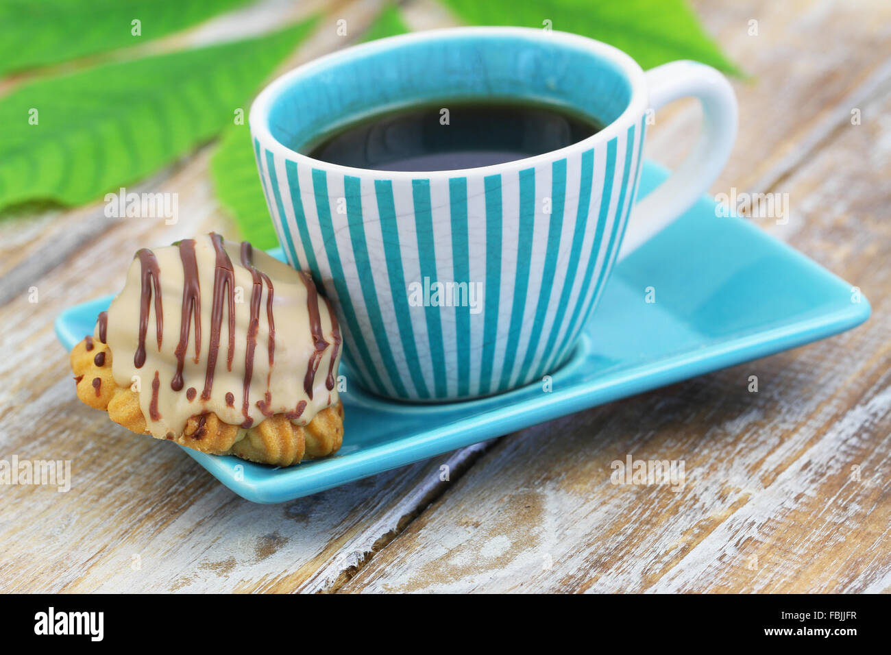 Cup of coffee and chocolate and toffee cookie Stock Photo