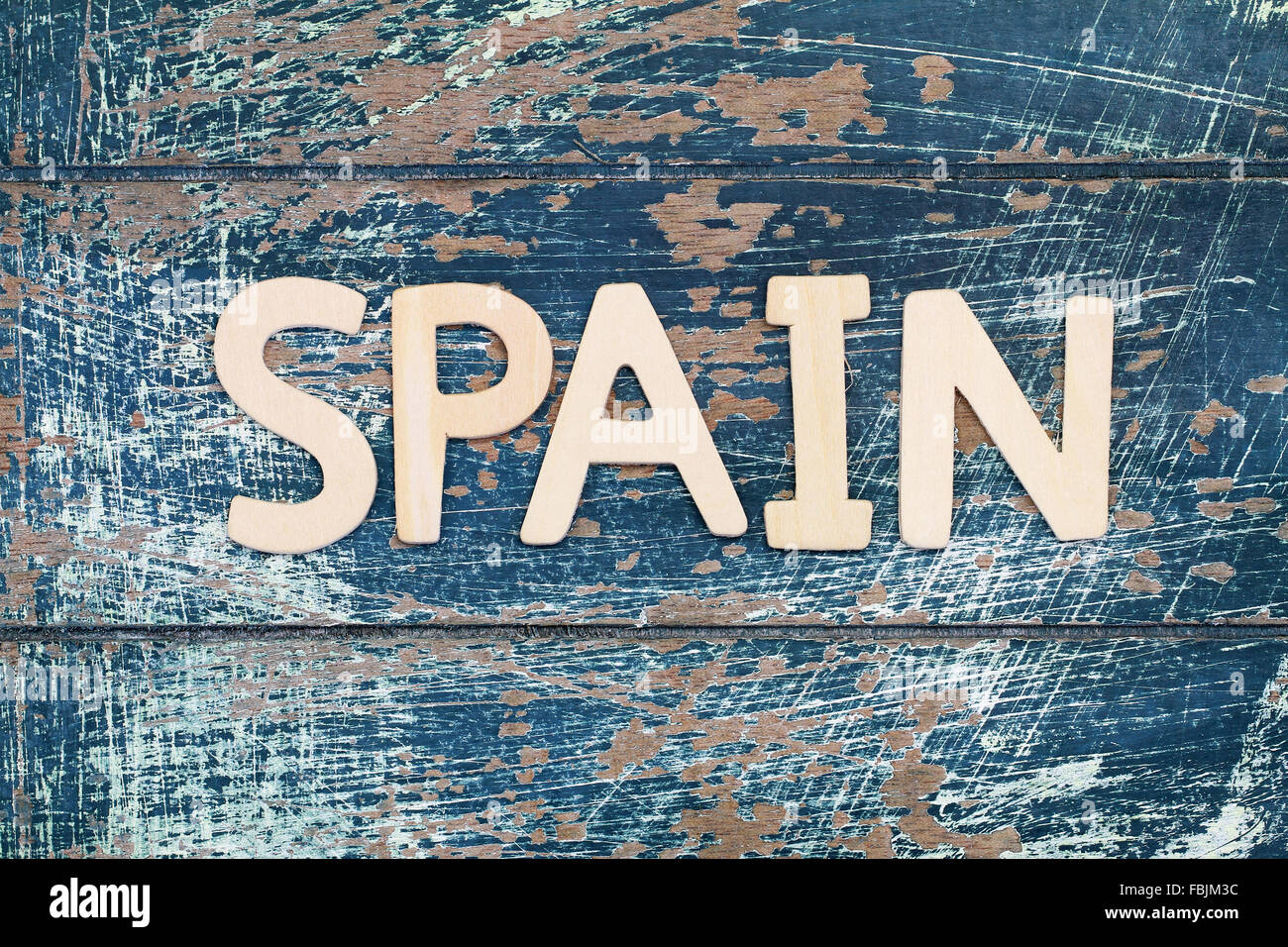 Spain written with wooden letters on rustic surface Stock Photo