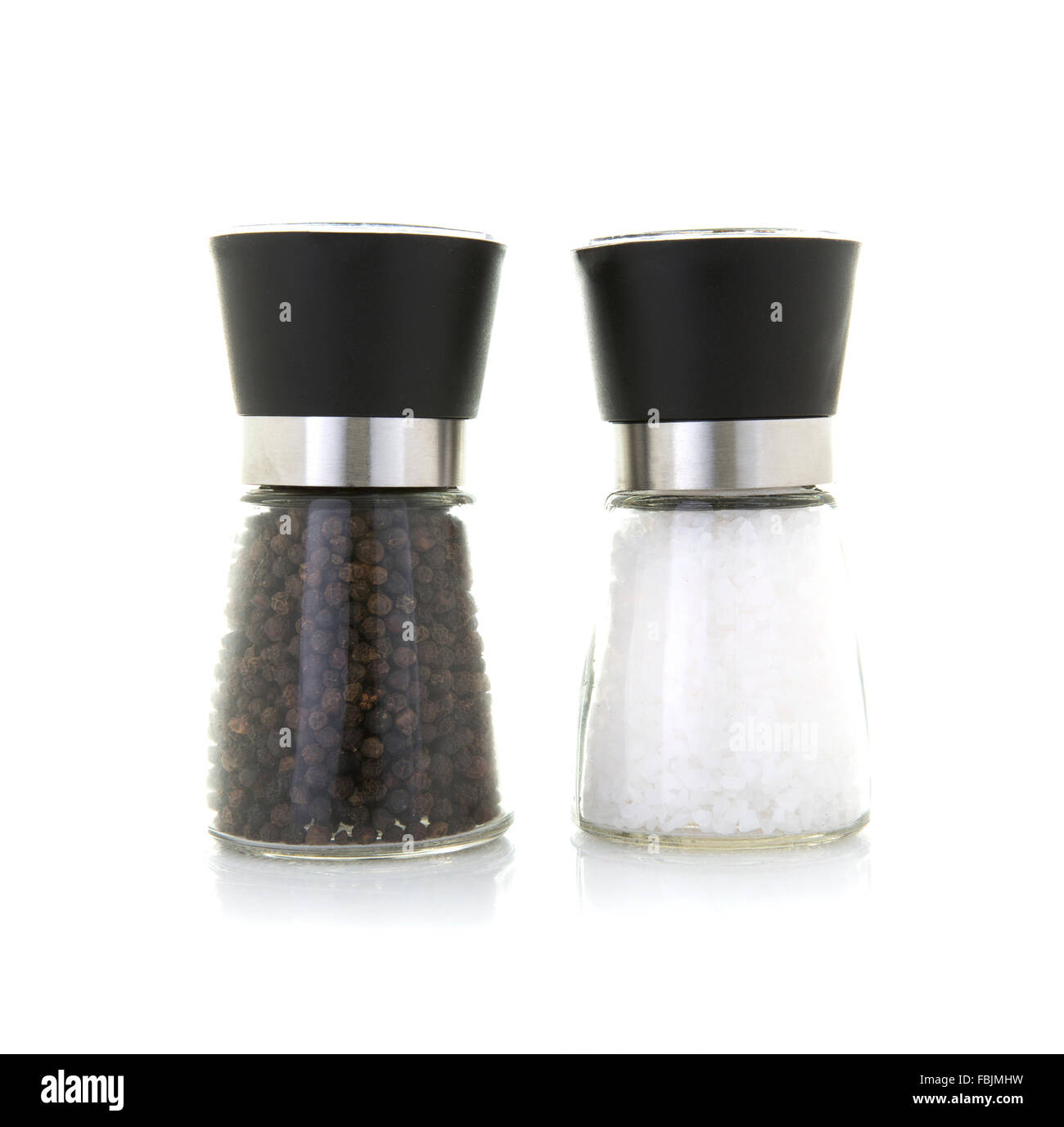 Glass salt and pepper grinders on a white background Stock Photo Alamy