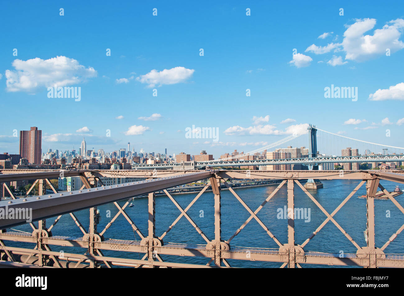 New York, United States of America: skyline, skyscrapers and Manhattan Bridge seen from Brooklyn Bridge Stock Photo