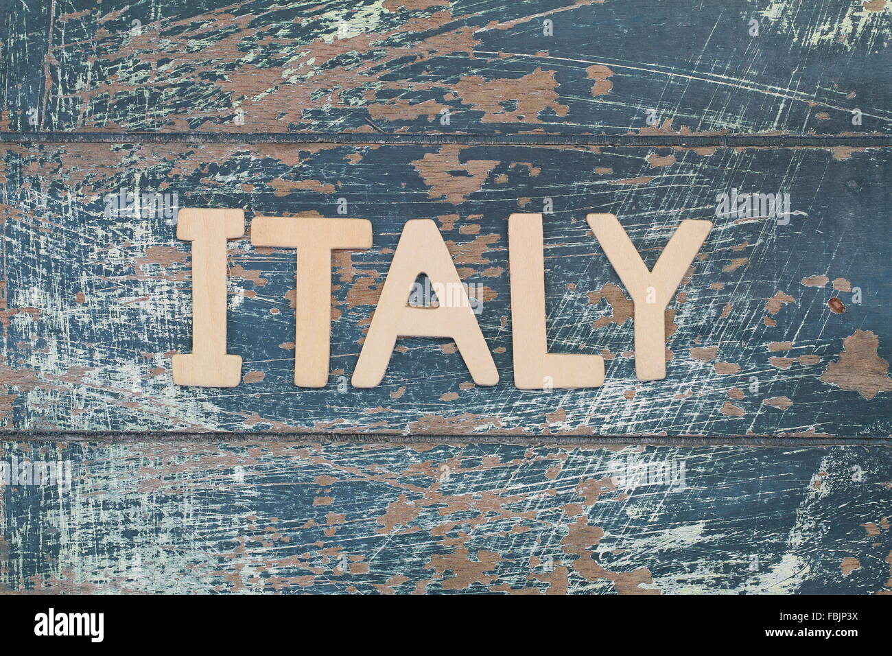 Italy written with wooden letters on rustic surface Stock Photo