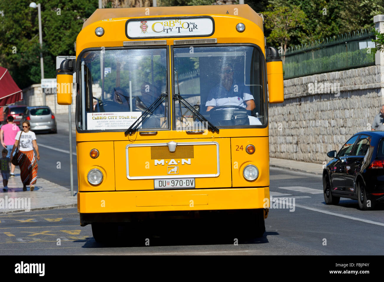 A public yellow bus in Dubrovnik, Croatia. Stock Photo