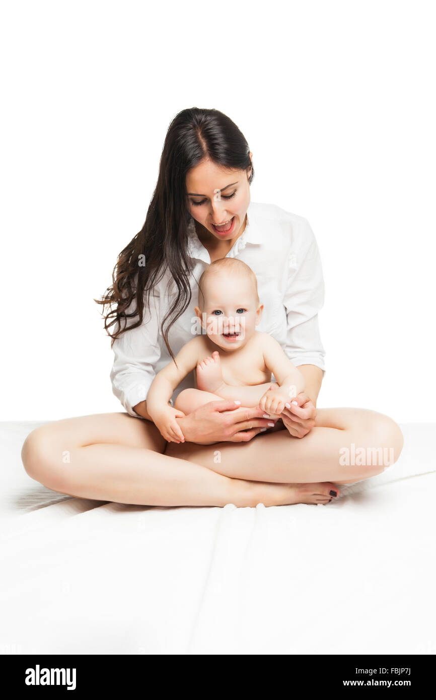 Young mother sitting with cute baby boy Stock Photo