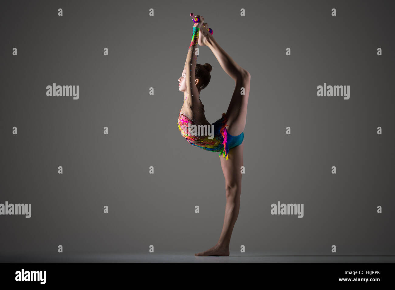 Female gymnast standing on one leg hires stock photography and images