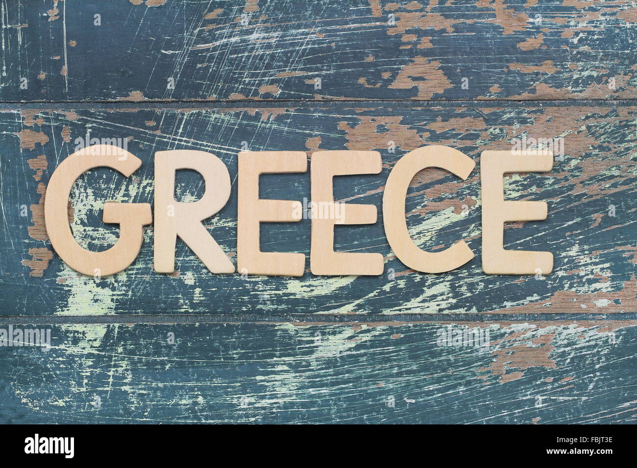 Greece written with wooden letters on rustic surface Stock Photo