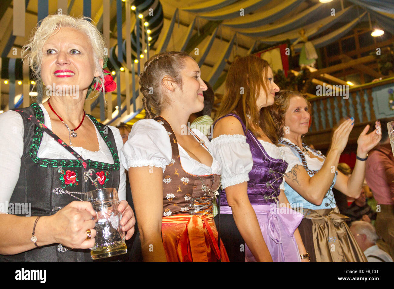 A Group Of Women In Costume Wearing Dirndls Celebrating Oktoberfest In A Beer Tent In Munich Germany Stock Photo Alamy