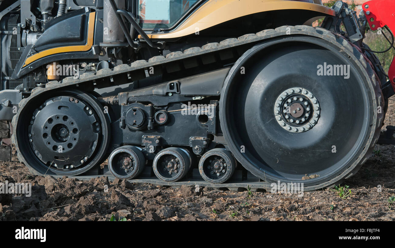 tractor outside with rubber crampons Stock Photo