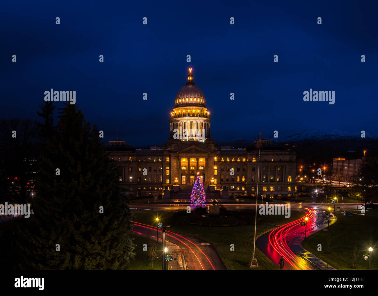 Christmas tree at the Idaho state capital building with car lights streaking Stock Photo