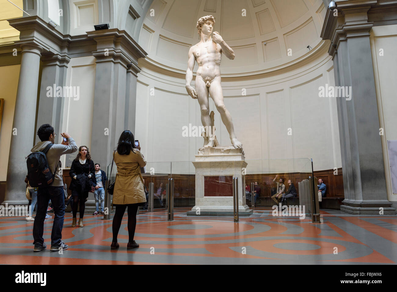 Florence. Italy. Tourists visit Michelangelo's statue of David at the Galleria dell'Accademia museum. Gallery of the Academy of Florence. Stock Photo