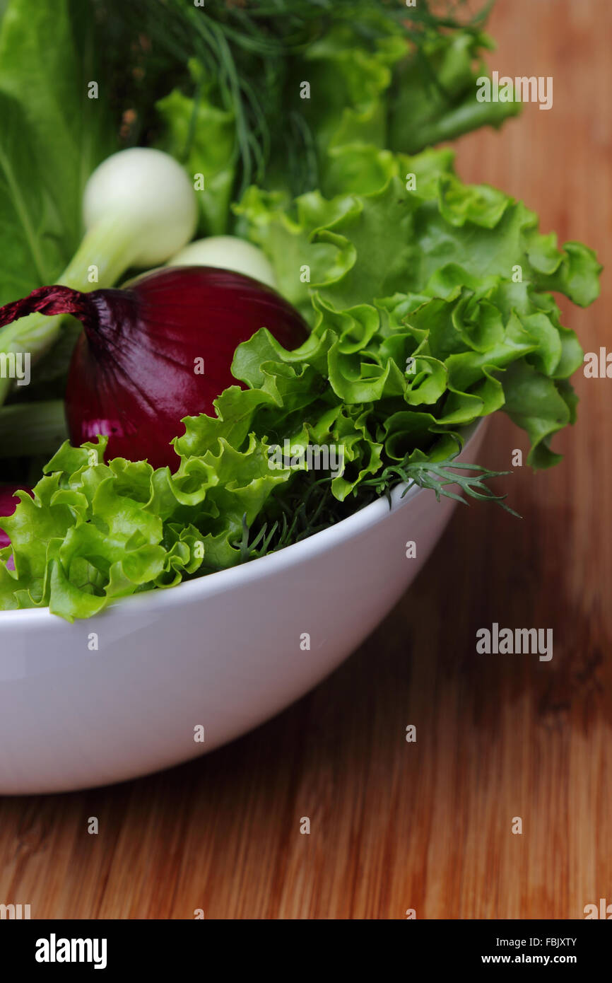 Heap of various fresh greens with lettuce, dill and beet Stock Photo