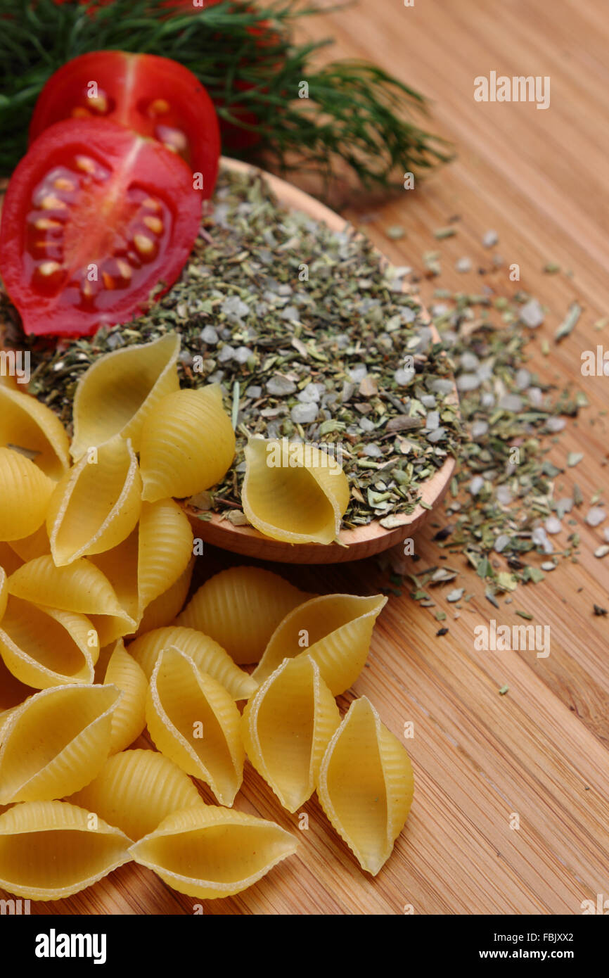 Pasta and fresh cherry tomatoes with spices Stock Photo