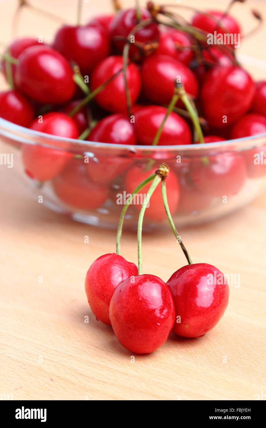 Group of cherries on wooden table Stock Photo