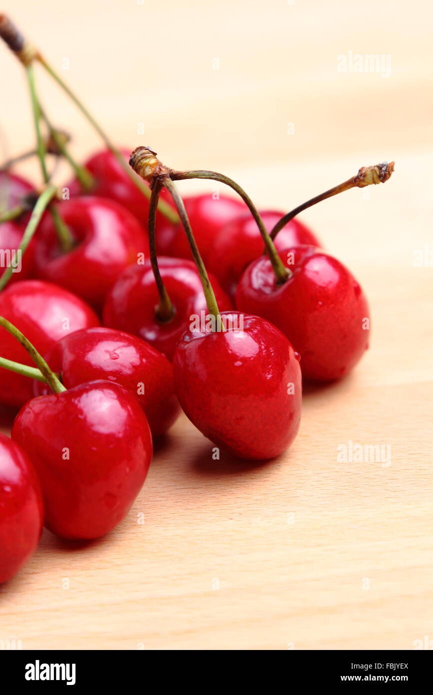 Beautiful natural ripe cherries on a wooden background Stock Photo