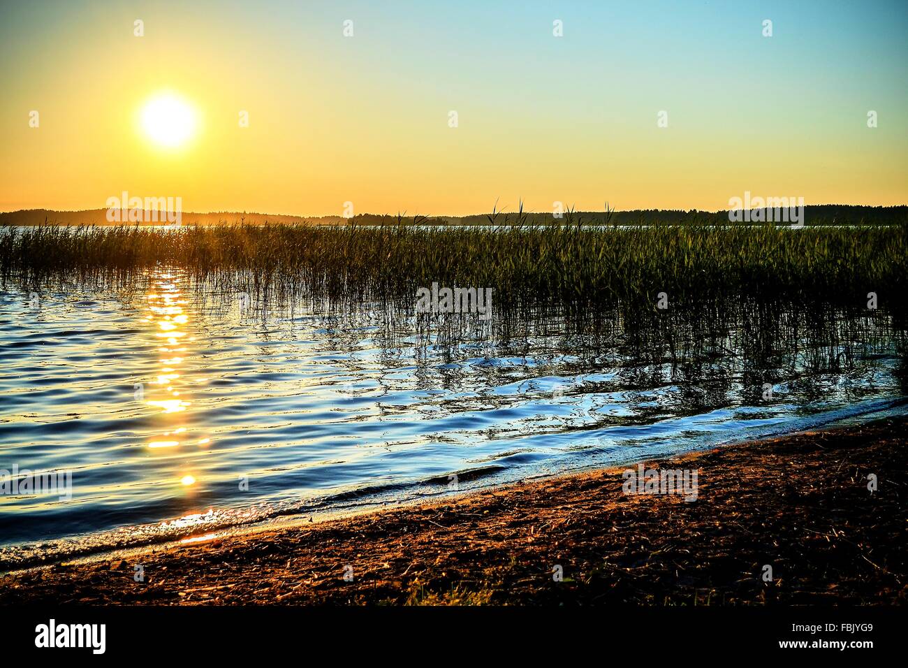 The evening sun sets over the stunning Lake Plateliai in Lithuania HDR Stock Photo