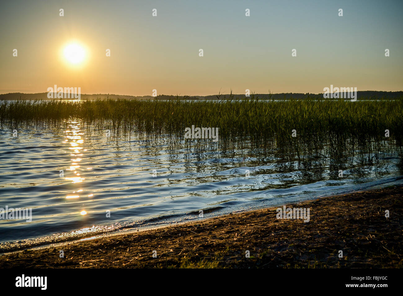 The evening sun sets over the stunning Lake Plateliai in Lithuania Stock Photo