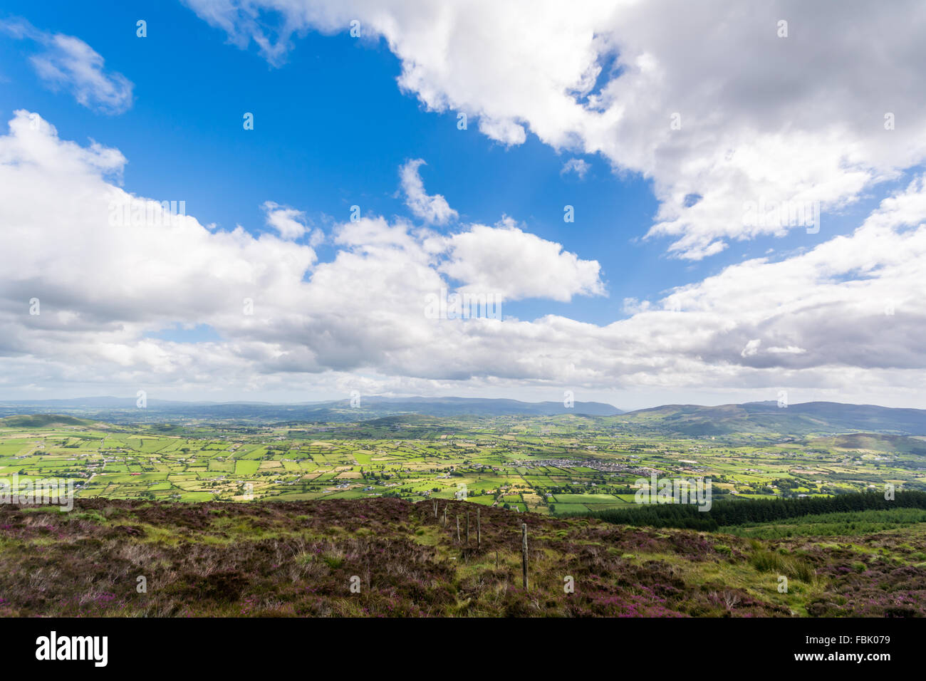 The view standing on top of Slieve Gullion looking over towards the Mourne Mountain range in Northern Ireland Stock Photo