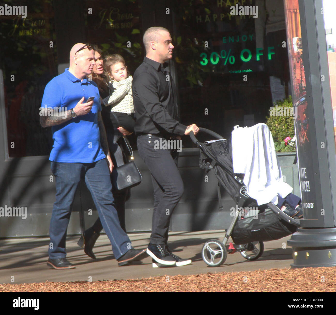 Robbie Williams takes his family shopping at The Grove in Hollywood  Featuring: Robbie Williams, Ayda Field, Theodora Rose Williams Where: Hollywood, California, United States When: 17 Dec 2015 Stock Photo