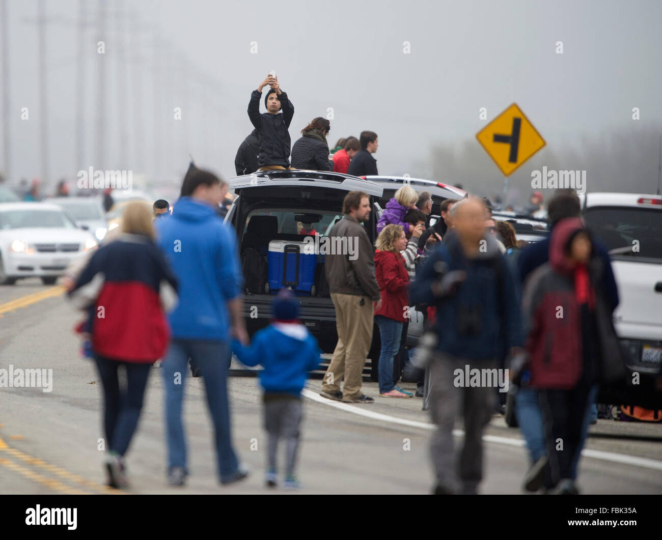 Lompoc, USA. 17th Jan, 2016. Thousands of people watch the launch of Falcon 9 rocket near Vandenberg Air Force Base in California, the United States, on Jan. 17, 2016. U.S. private spacecraft company SpaceX launched on Sunday morning the Jason-3 ocean-measuring satellite, but failed in its attempt to land the spent first stage of its Falcon 9 rocket on a ship in the Ocean. Credit:  Yang Lei/Xinhua/Alamy Live News Stock Photo