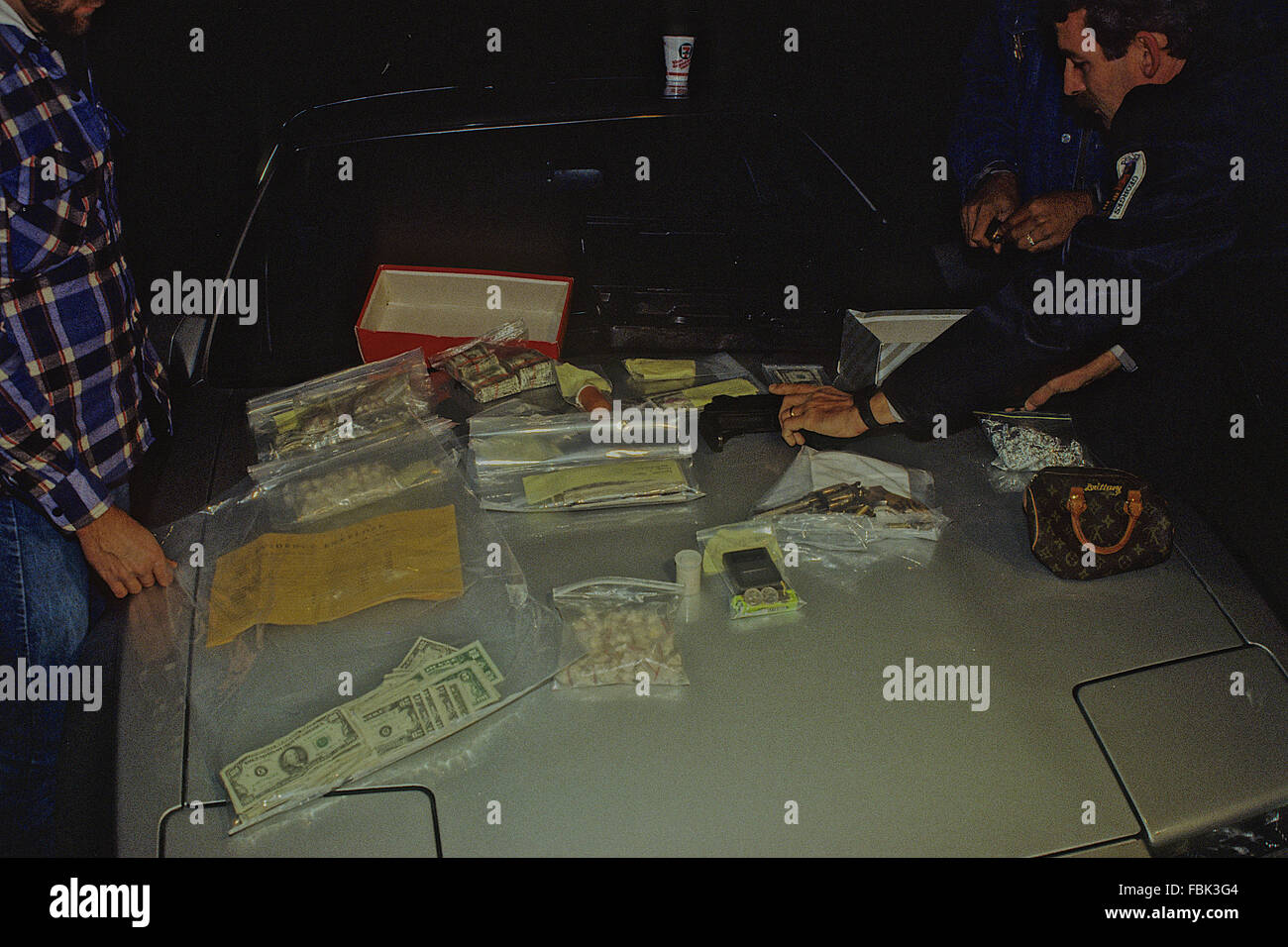 Adelphi, Maryland, USA, 19th November, 1988 Prince Georges County Police display the results of just one nights work of arresting street level crack cocaine dealers.  Credit: Mark Reinstein Stock Photo