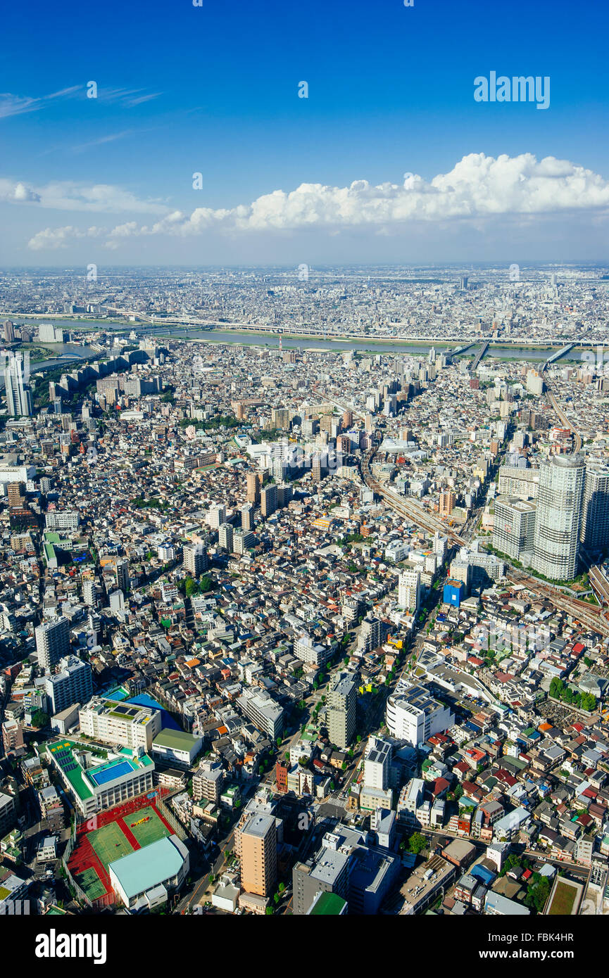The bird's eye view of the Tokyo city center from Tokyo Sky Tree tower in the afternoon with the blue sky and clouds Stock Photo