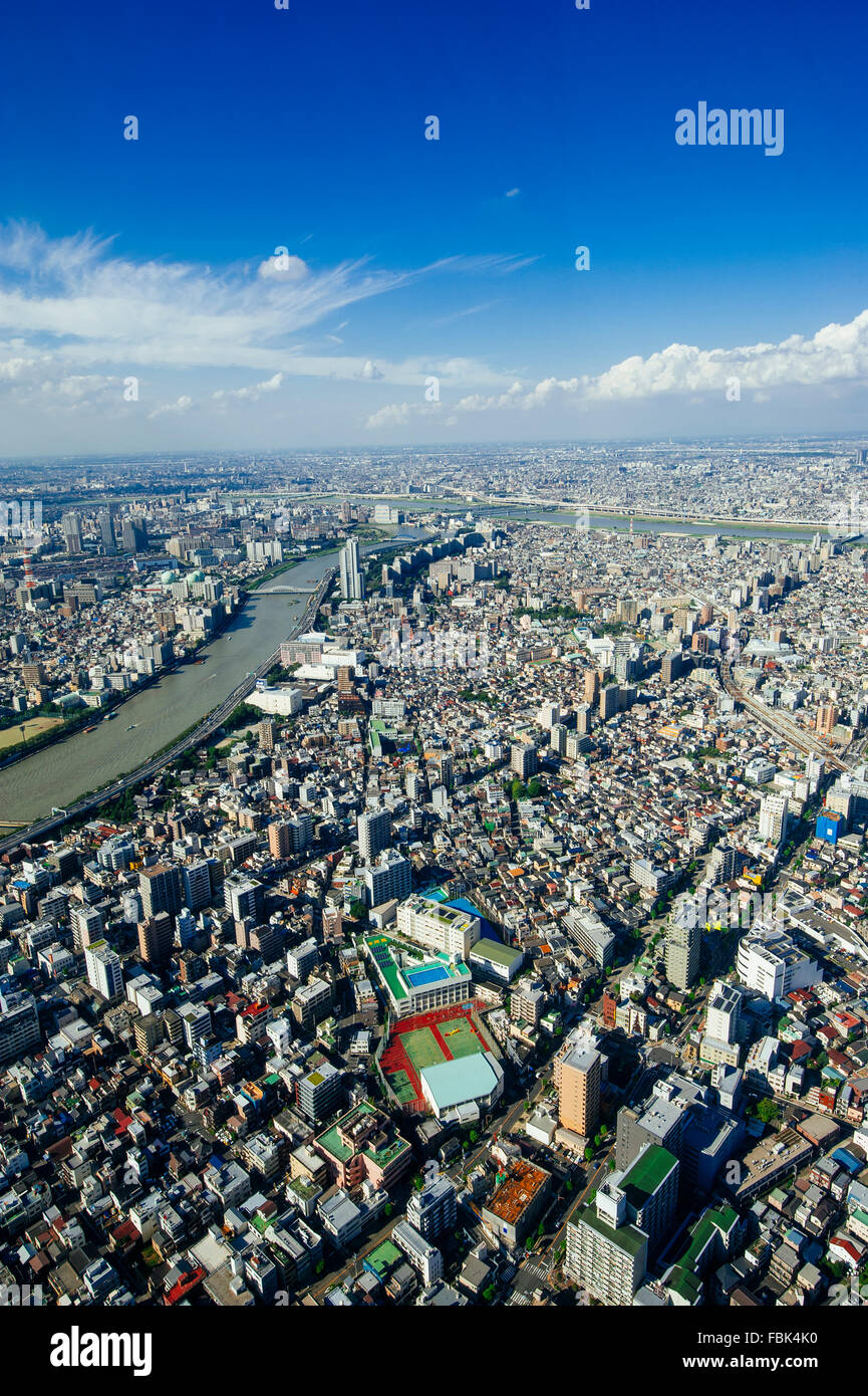 The bird's eye view of the Tokyo city center from Tokyo Sky Tree tower in the afternoon with the blue sky and clouds Stock Photo