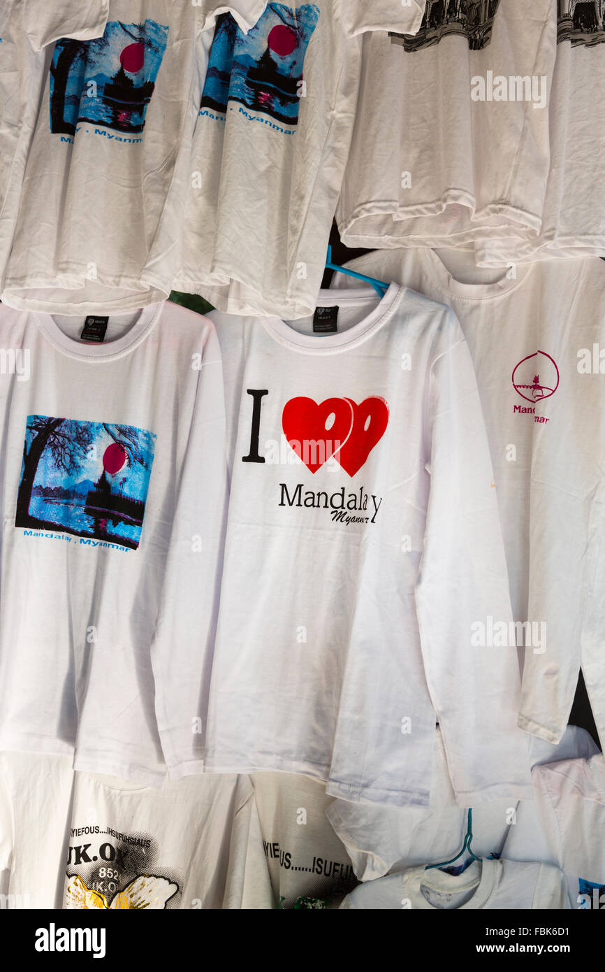 Typical white 'I love Mandalay' logo souvenir t-shirts hanging on a rail on sale at a stall in Mandalay Hill pagoda, Mandalay, Myanmar (Burma) Stock Photo