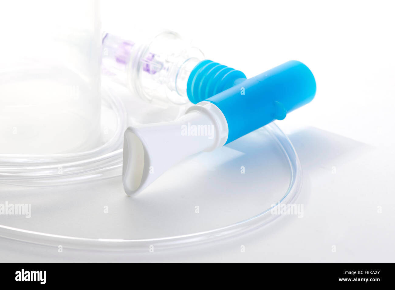 Breathing treatment nebulizer mouthpiece with tubing and canister. Stock Photo