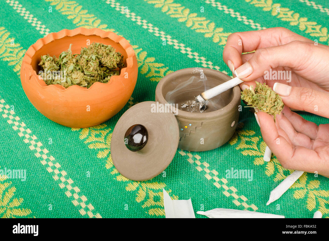 Female hand holding a lit marihuana joint Stock Photo Alamy