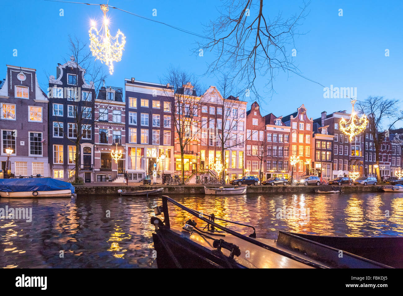 The Ambassade Hotel on the Amsterdam Herengracht Canal in winter with seasonal Christmas lights. Stock Photo