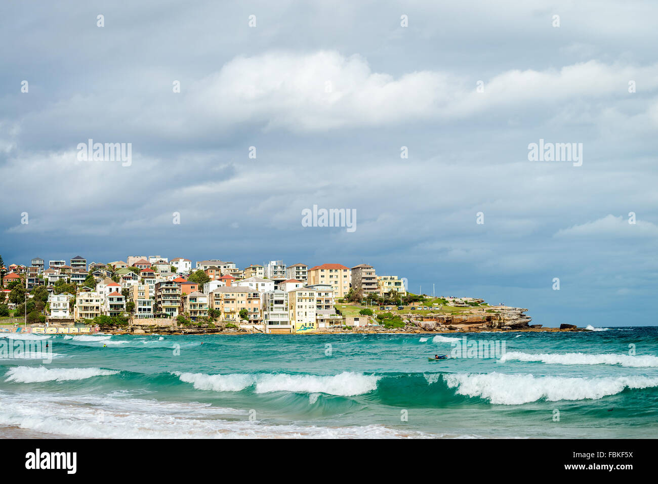Sydney, Australia - November 8, 2015: Surfer in the waters of Bondi Beach. Bondi beach is one of the most famous places. Stock Photo
