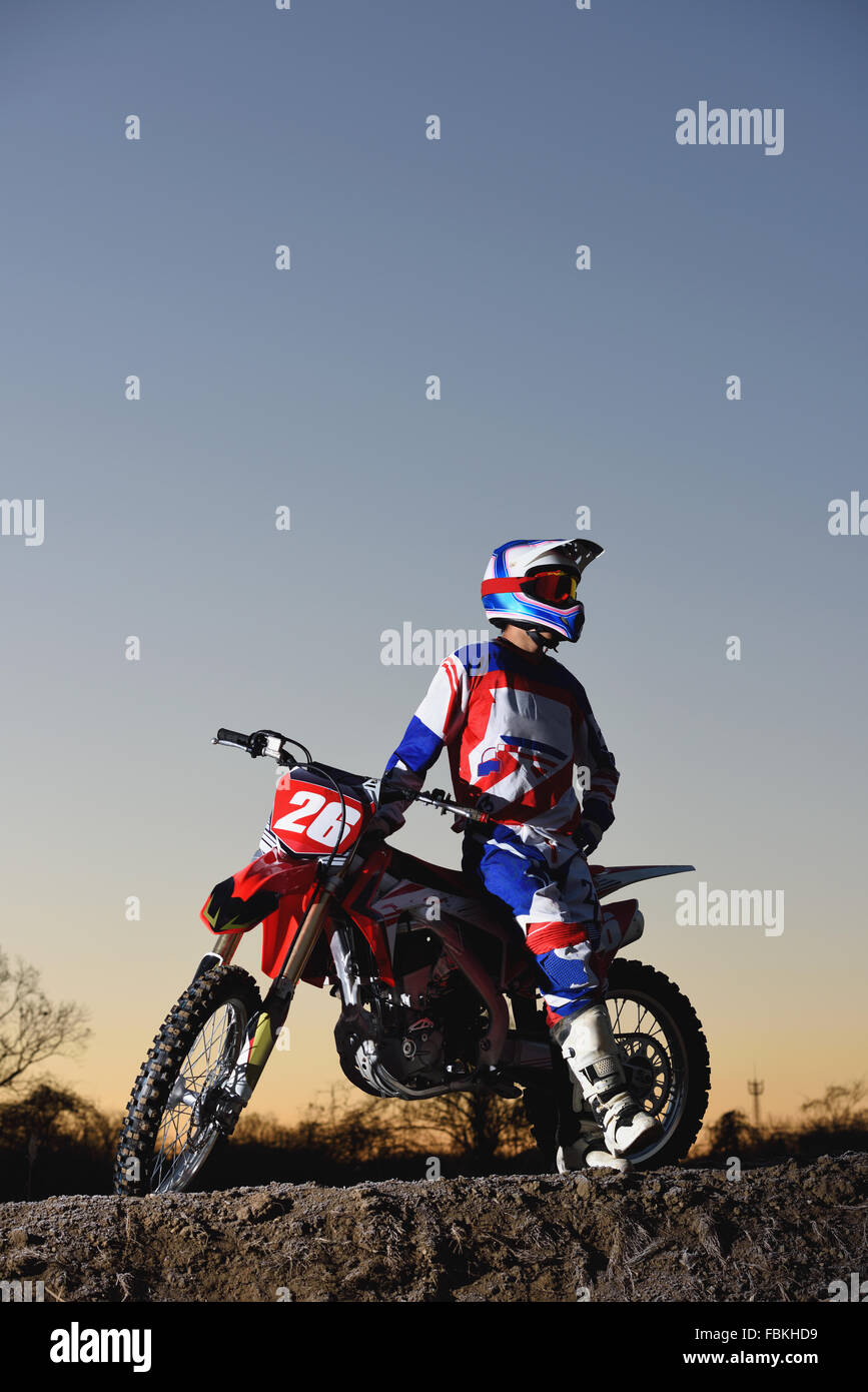 Motocross biker on dirt track Stock Photo