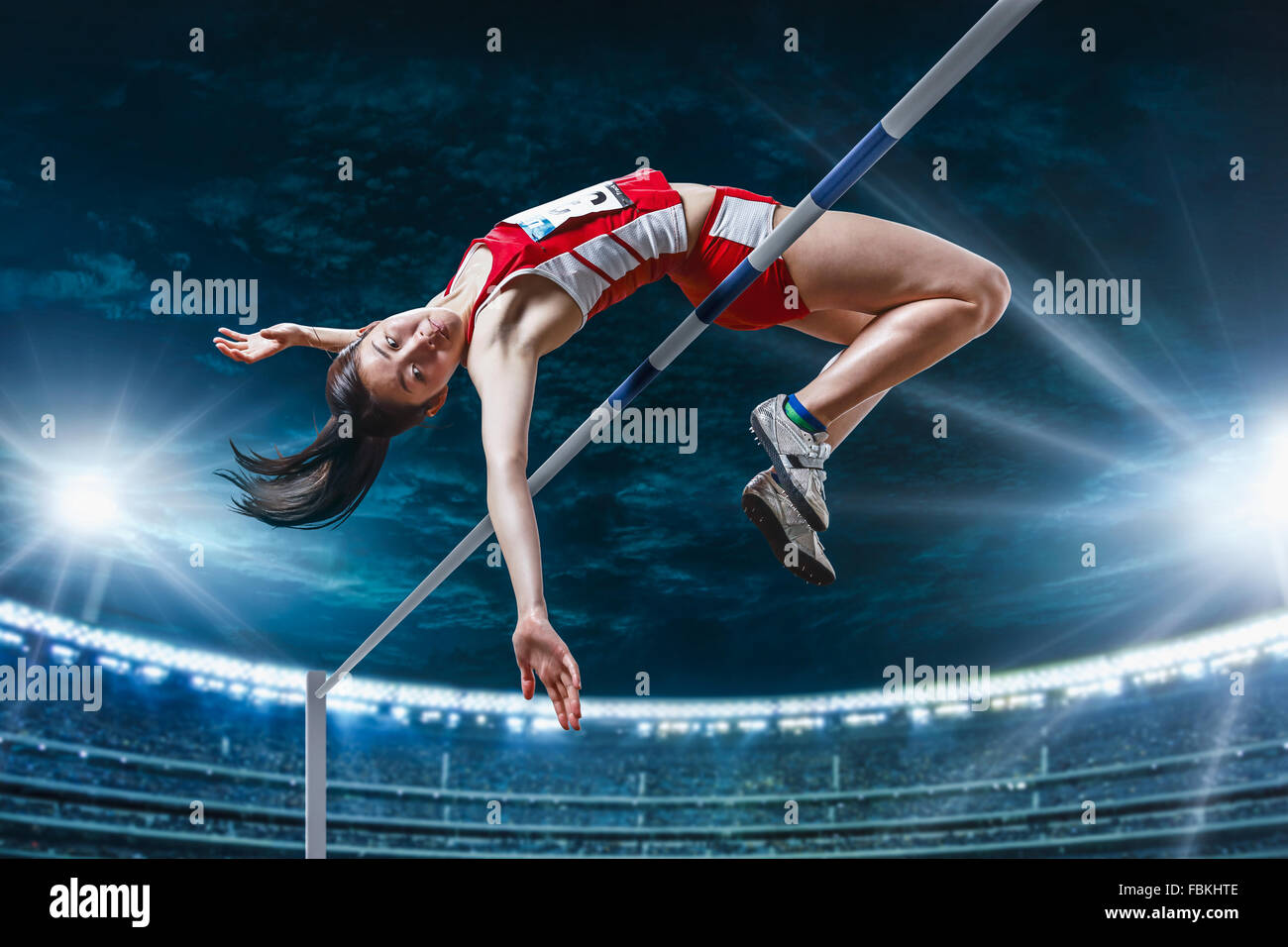 Japanese female high jump athlete jumping Stock Photo