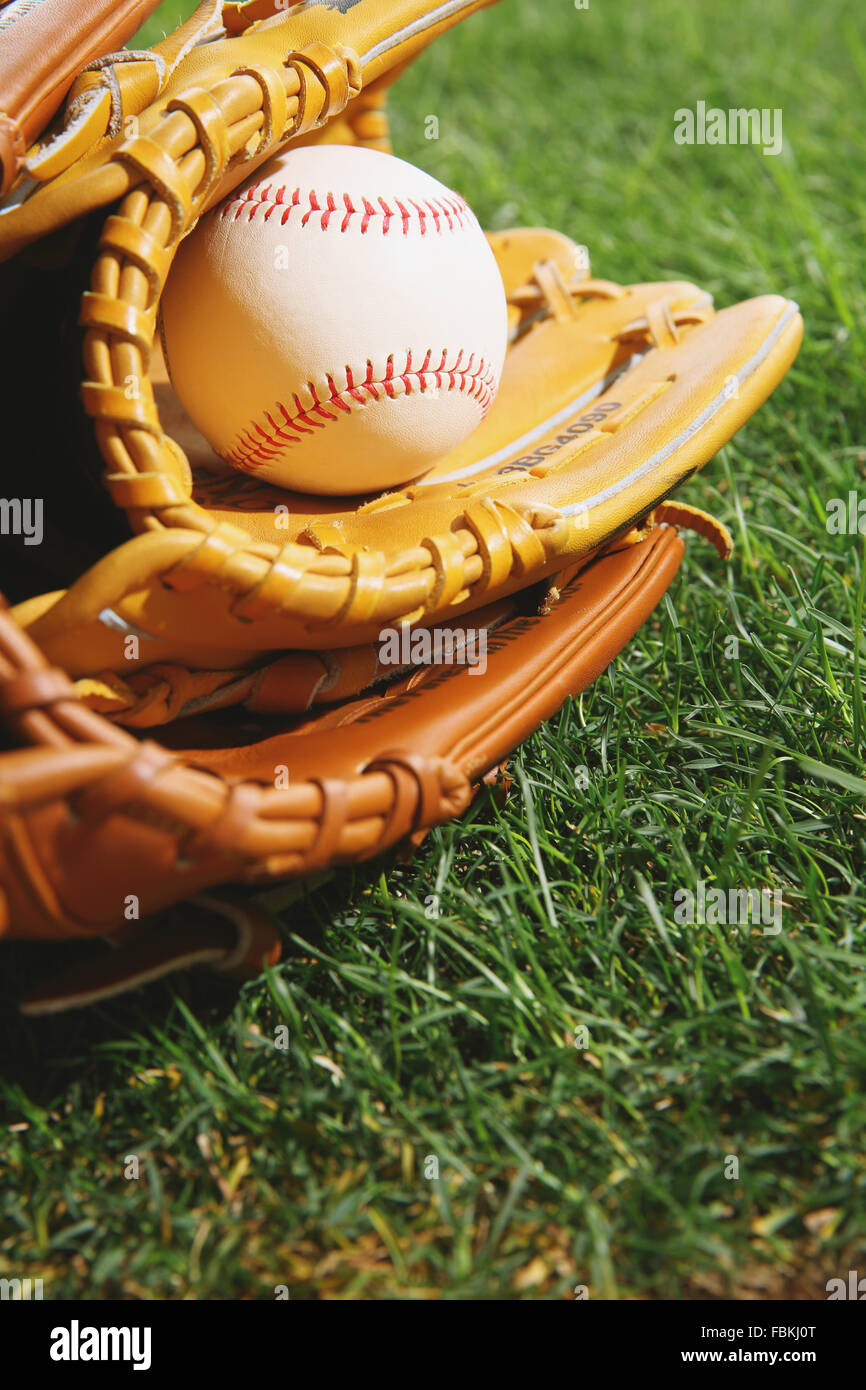 Baseball equipment on grass Stock Photo - Alamy