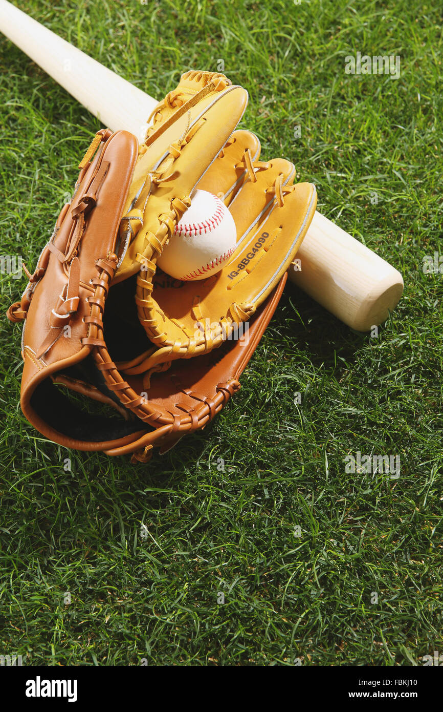 Baseball equipment on grass Stock Photo - Alamy
