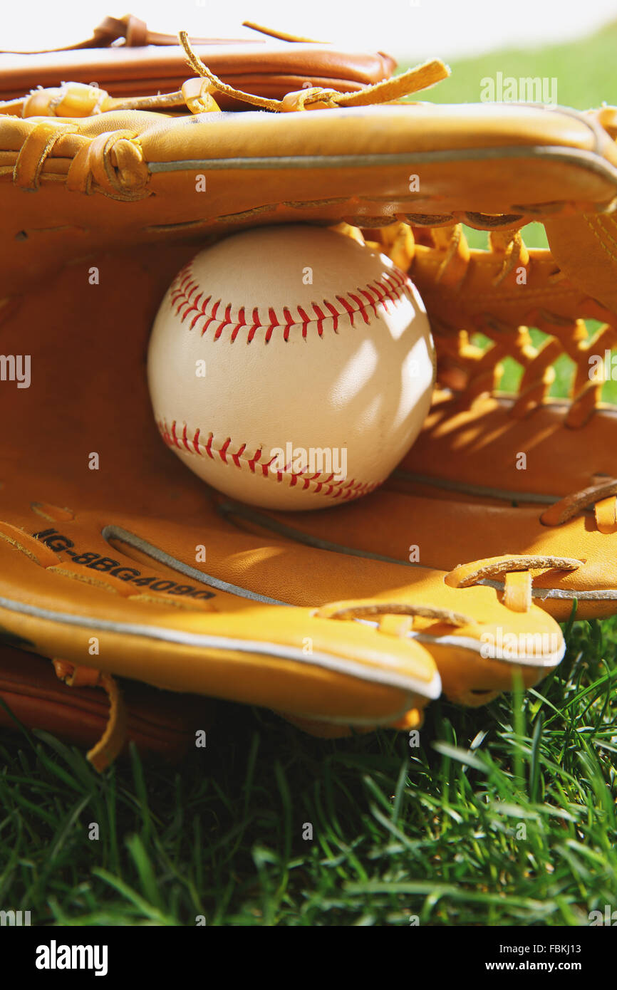 Baseball equipment on grass Stock Photo - Alamy