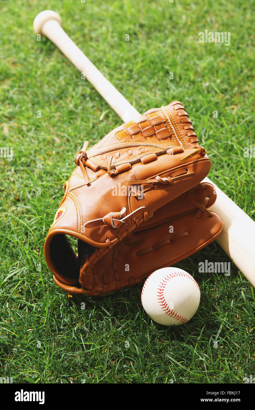 Baseball equipment on grass Stock Photo - Alamy