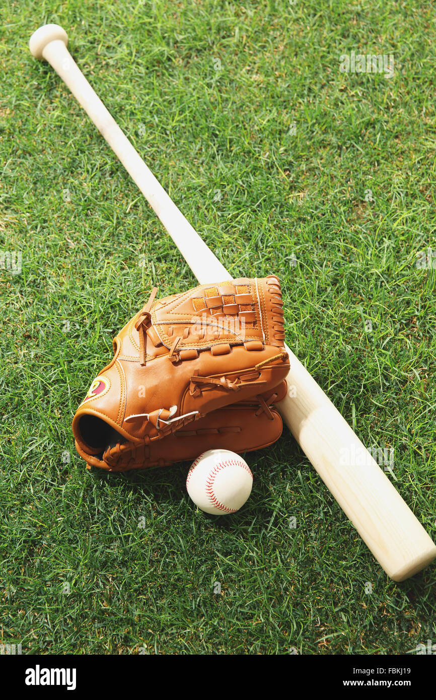 Baseball equipment on grass Stock Photo - Alamy