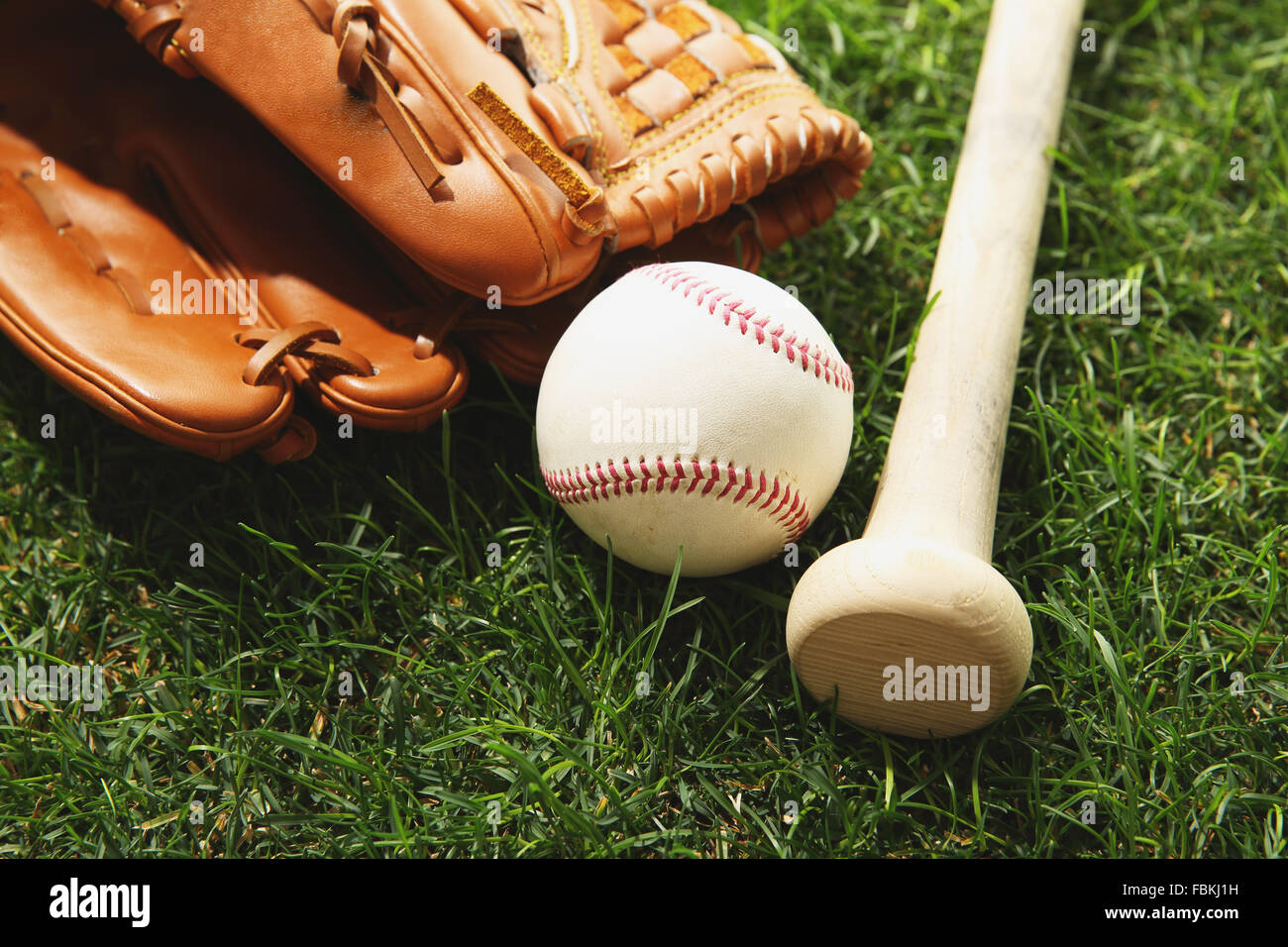 Baseball equipment on grass Stock Photo - Alamy