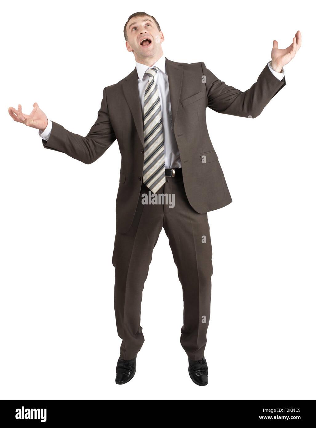 Businessman posing with arms raised Stock Photo - Alamy