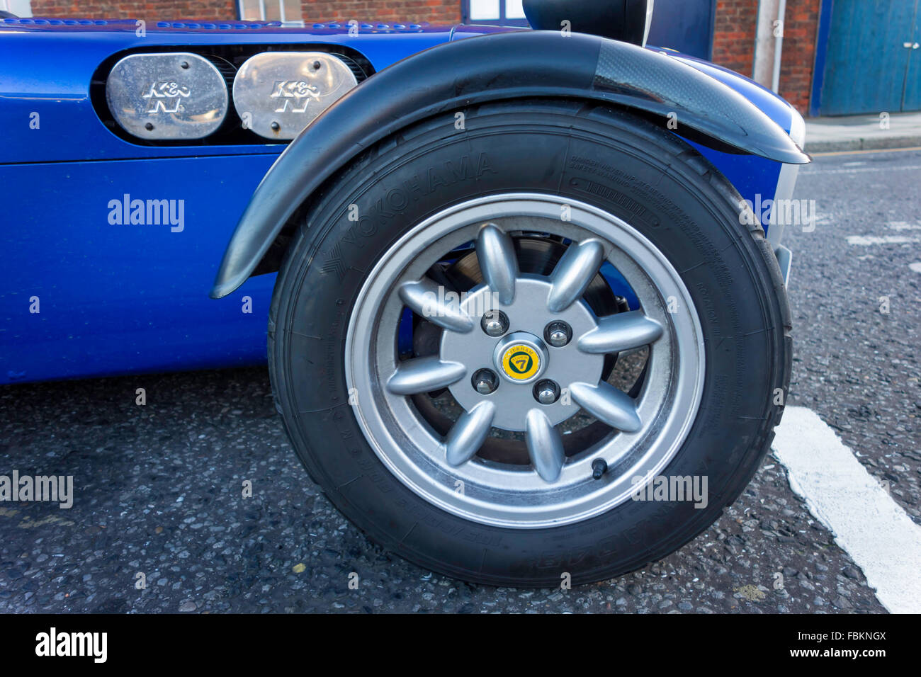 A 1997 registered blue Caterham 7 lightweight sports car front wheel detail Stock Photo