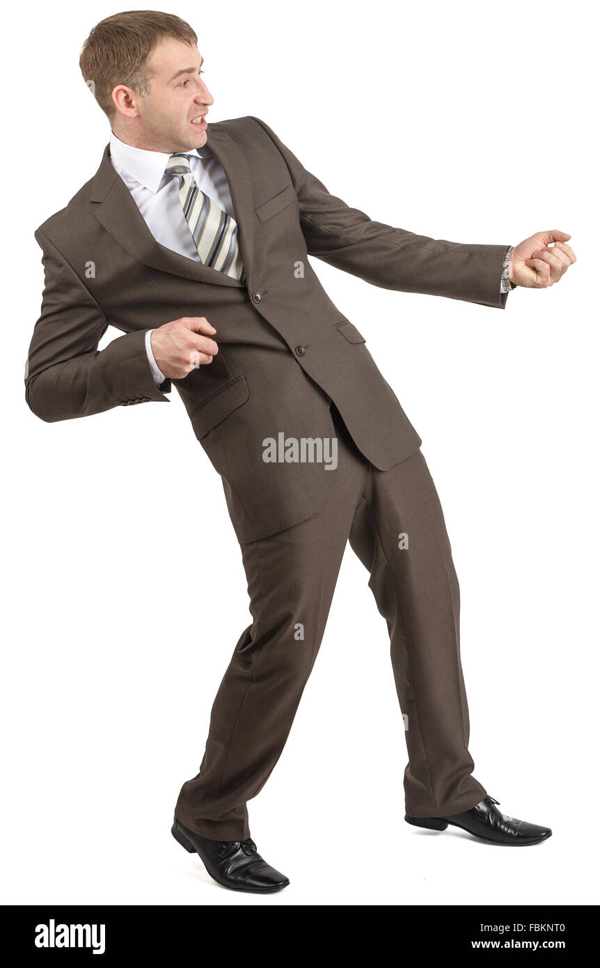 Businessman pulling invisible rope Stock Photo - Alamy