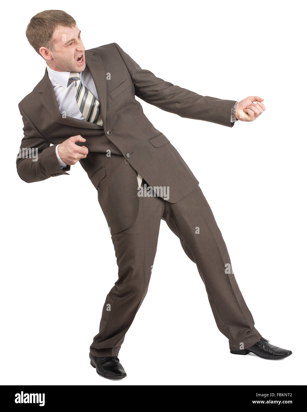 Businessman pulling invisible rope Stock Photo - Alamy