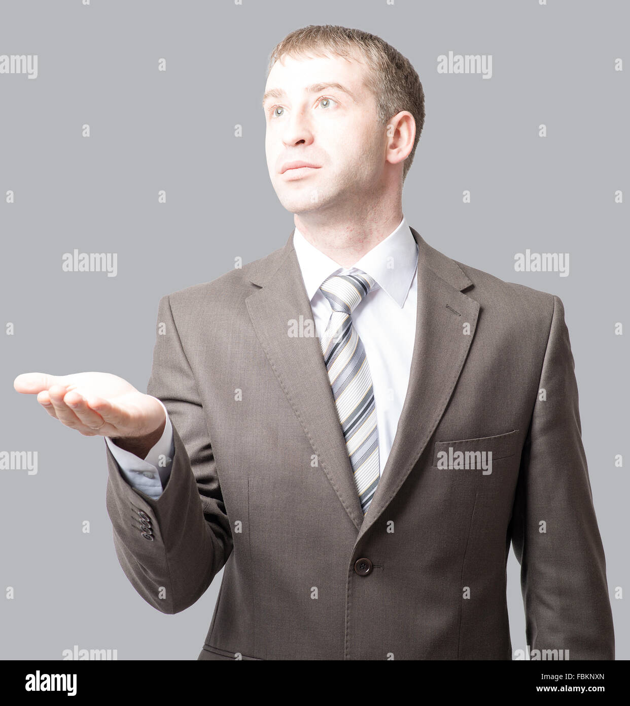 Businessman with outstretched hand Stock Photo